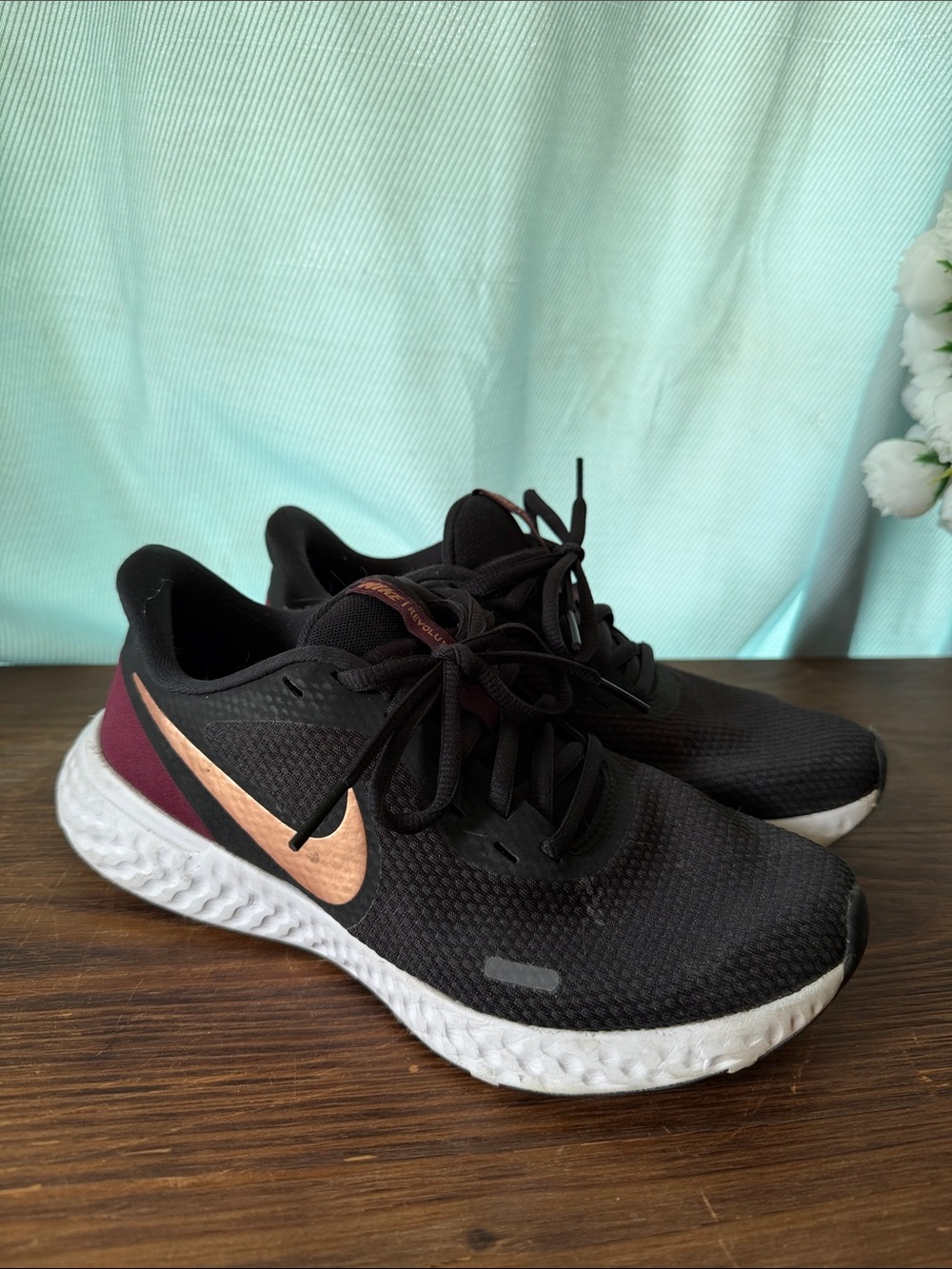 Nike Women's Black Running Shoes with Rose Gold Swoosh and Maroon Heel